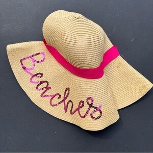 Beach hat with pink ribbon